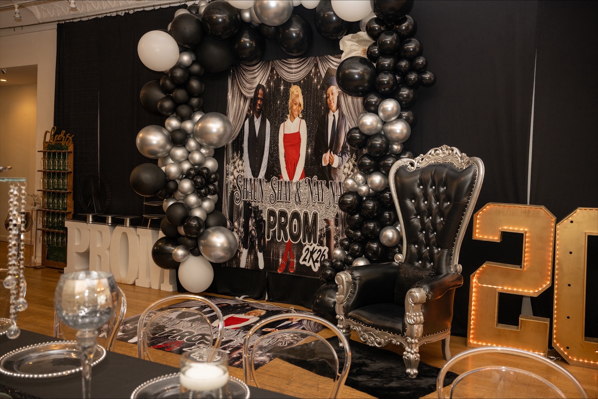 Gallery photo of prom-themed balloon installation and event chair setup